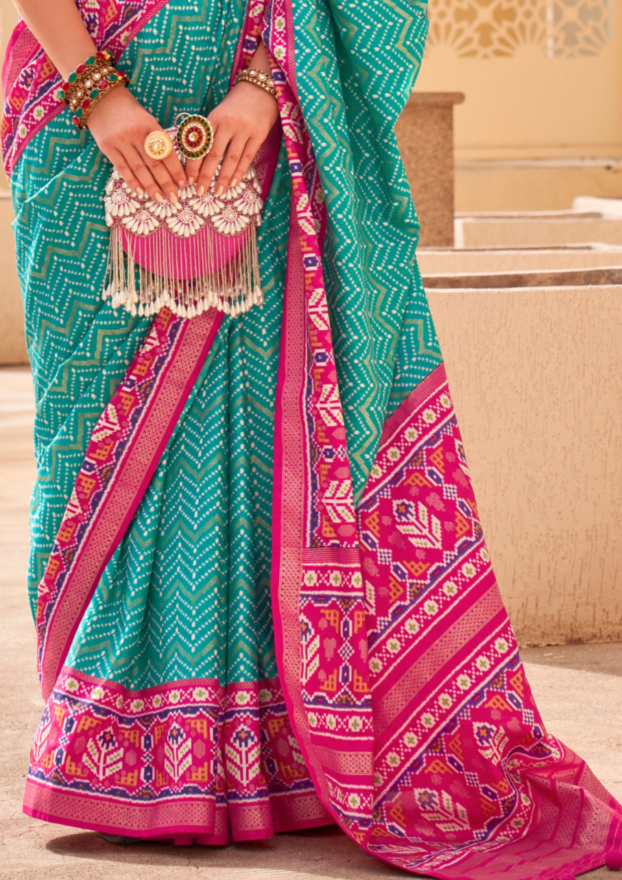 PV Silk Patola Design Turquoise Blue Saree With Contrast Border
