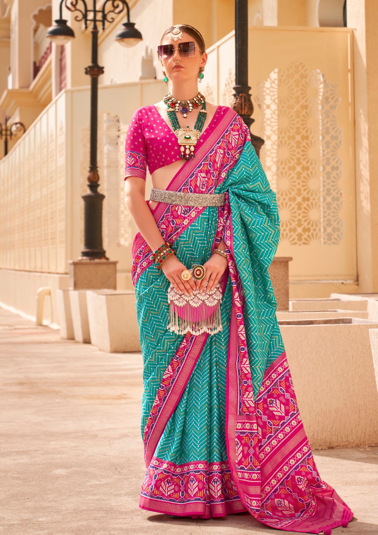PV Silk Patola Design Turquoise Blue Saree With Contrast Border