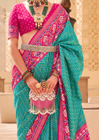 PV Silk Patola Design Turquoise Blue Saree With Contrast Border