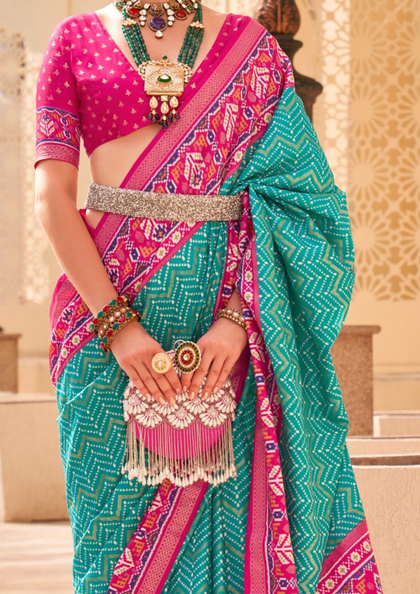 PV Silk Patola Design Turquoise Blue Saree With Contrast Border