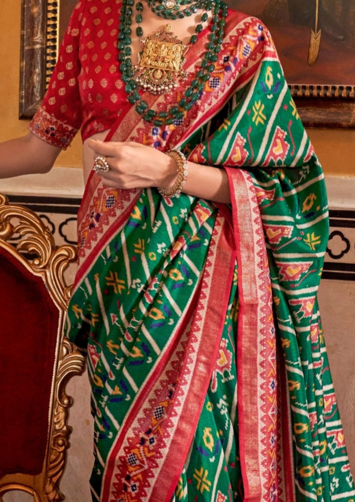 Super PV Silk Patola Design Dark Green Saree With Contrast Border