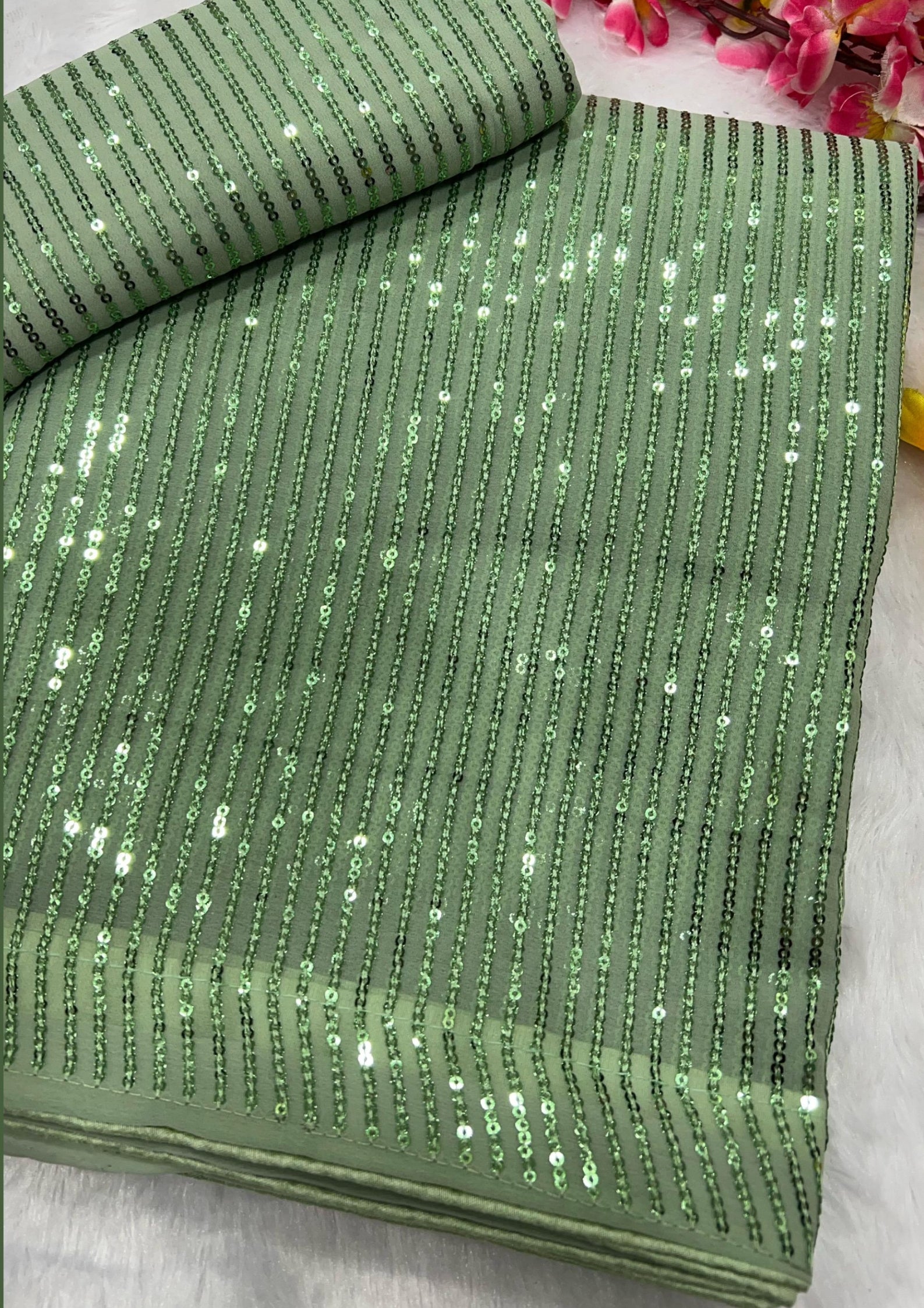 Shimmering Pastel Green Party Wear Georgette Saree
